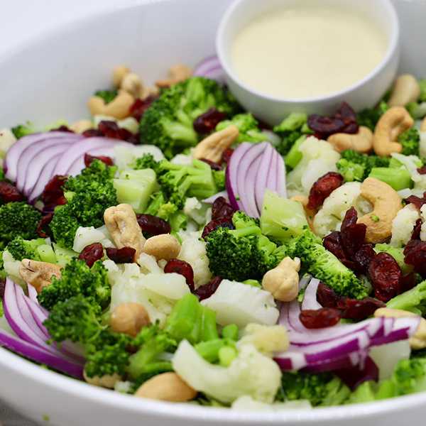 Broccoli And Cauliflower Salad With Sliced Red Onions, Cashews And Craisens In A Light Mayo - Red Wine Vinaigrette Dressing