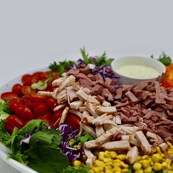 Deli Salad - Bed Of Romaine, Tomatoes, Pickles, Peppers, Corn, Purple Onion Crispy Fried Onions  - Garlic Mayo Dressing