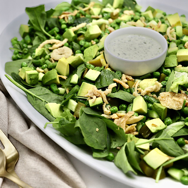 Green Harvest Salad: Mixed Greens, Grilled String Beans, Edemame, Sour Pickles, Cucumbers, Avocado and fried Onions with a Creamy Basil Dressing